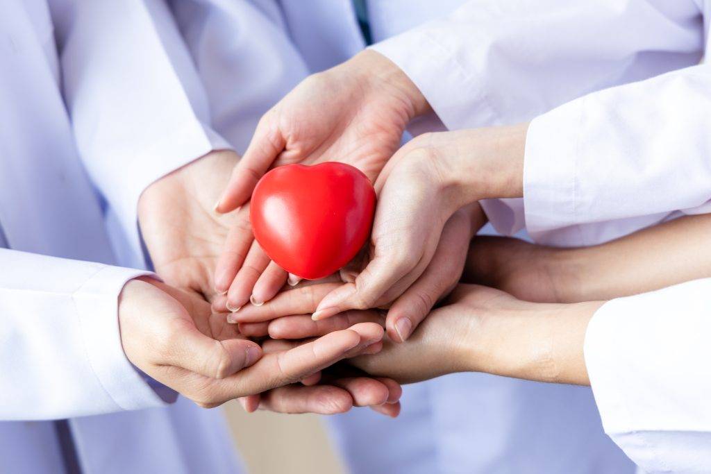 group-of-hands-holding-a-red-heart-hand-of-doctor-2023-11-27-04-55-12-utc-1024x683.jpeg
