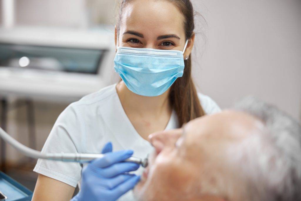 beautiful-female-dentist-using-a-1024x683.jpeg